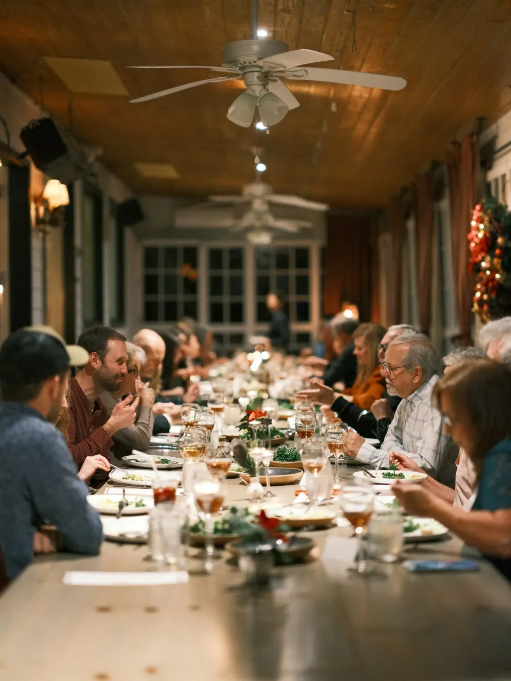 Several generations of a family at a long dinner table